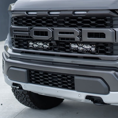 Baja Designs 2021+ Ford Raptor 10” OnX6 Behind Grill Kit - Clear Driving/Combo